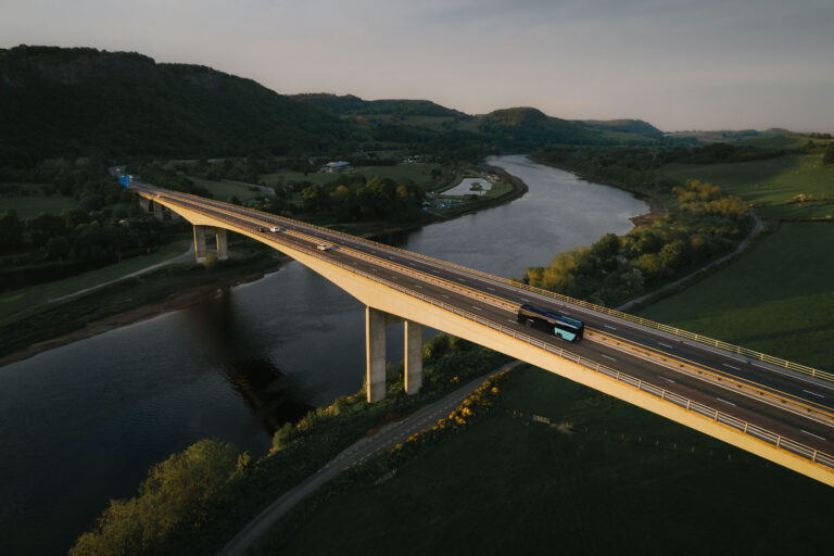 An aerial image showing Friarton Bridge crossing the River Tay near Perth, Perthshire in late evening sunshine.